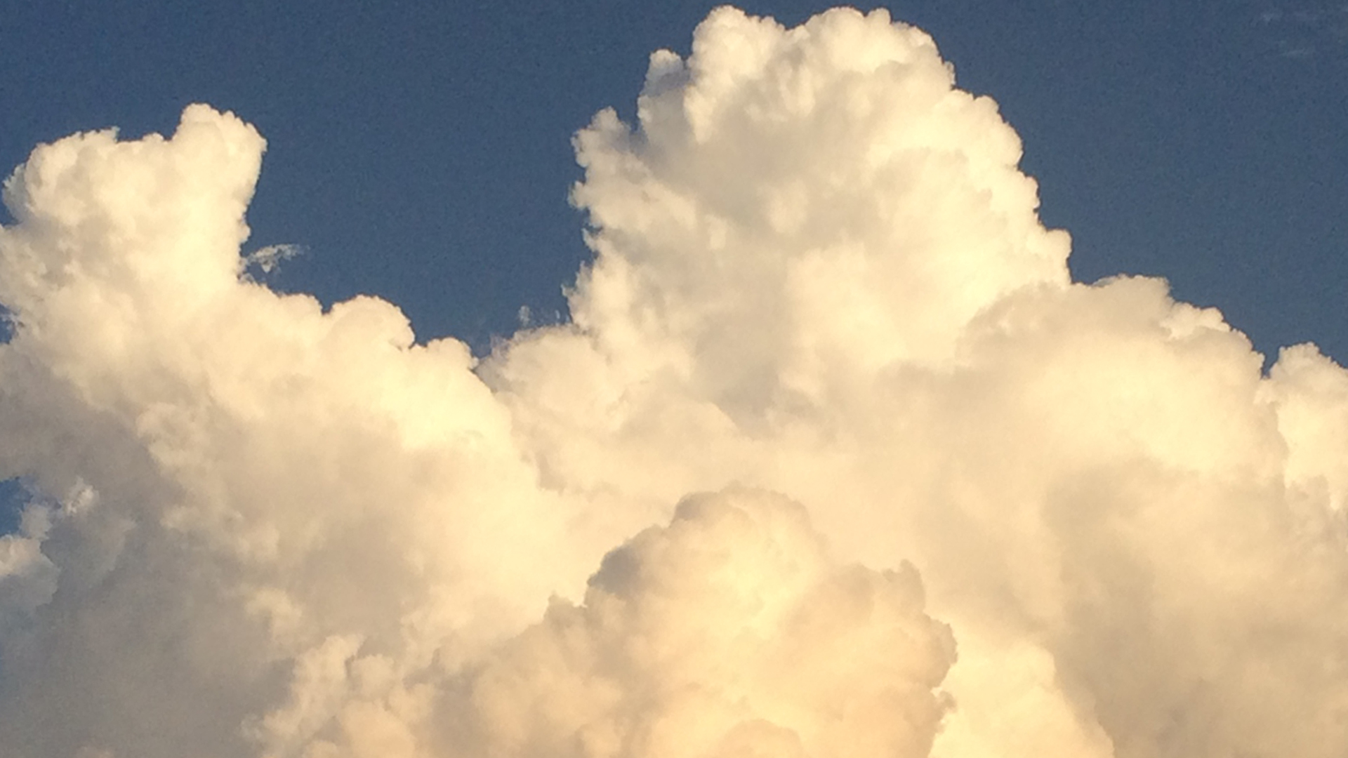 cumulus clouds in late afternoon light